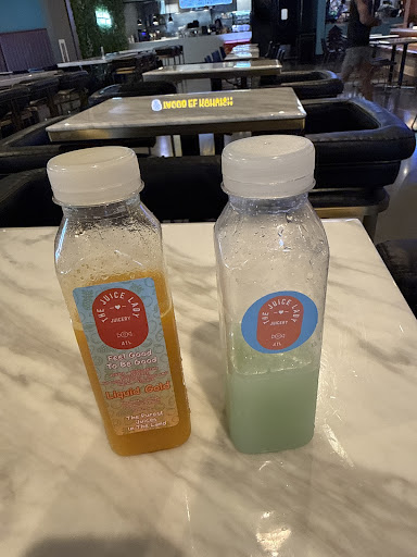Two The Juice Lady ATL juice bottles on a table